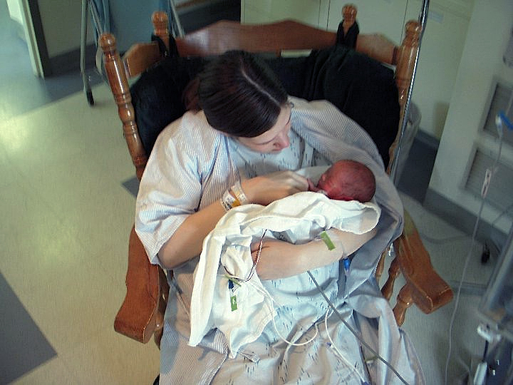 mom holding newborn baby