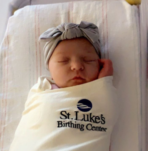 baby in St. Luke's blanket