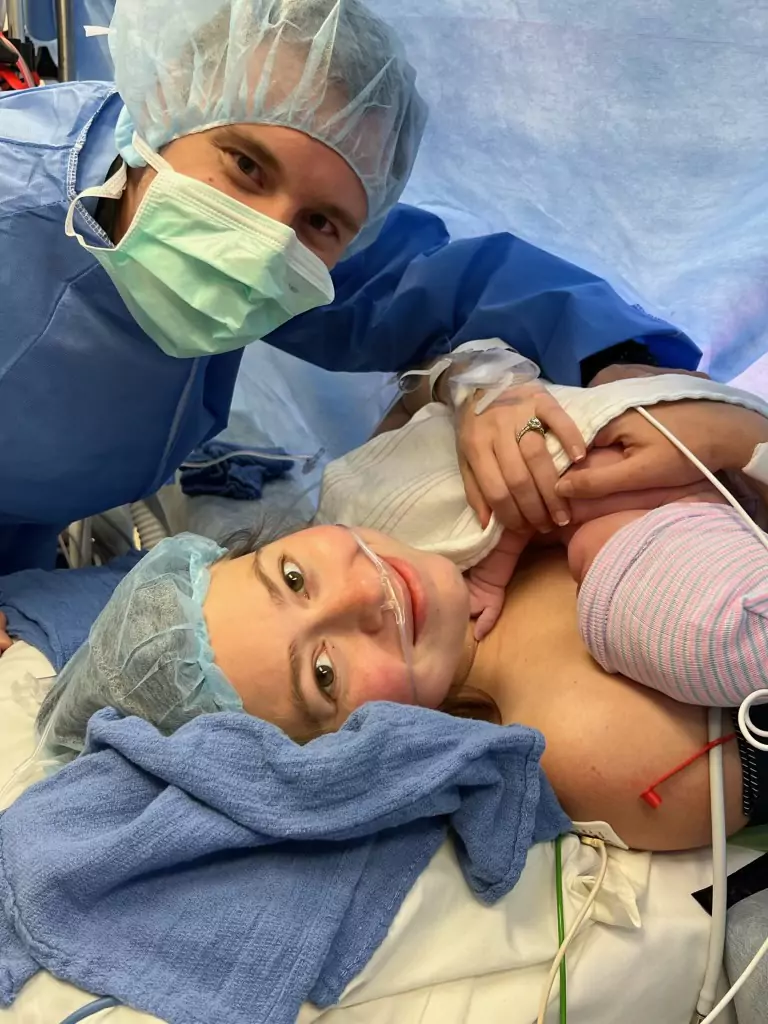 Mom and dad smiling after baby was delivered via C-Section.
